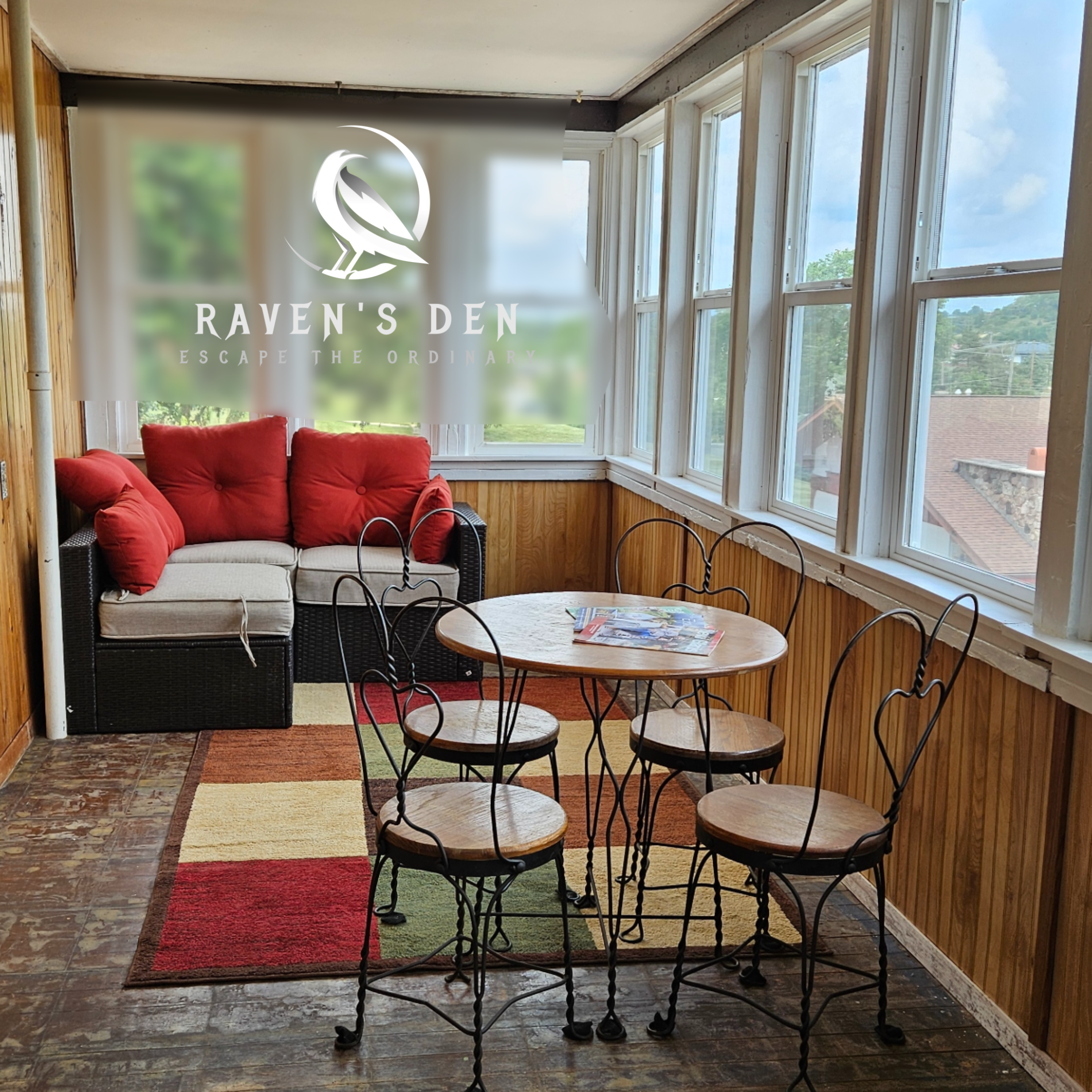 Raven's Den Sunroom with logo